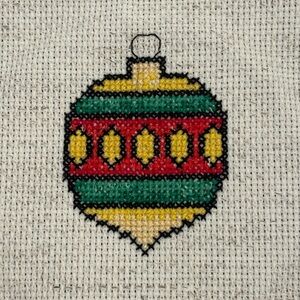 Festive Green and Red Holiday Ornament Completed cross stitch